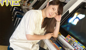 Retro game and anime collector Kana Urasawa posed next to a vintage Japanese arcade cabinet